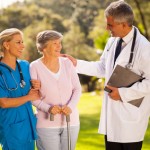 male doctor talking to recovering senior patient